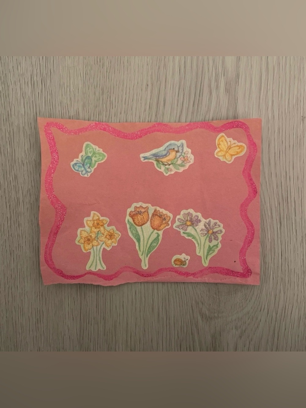 Collage with flowers, butterflies, ladybug, and bird